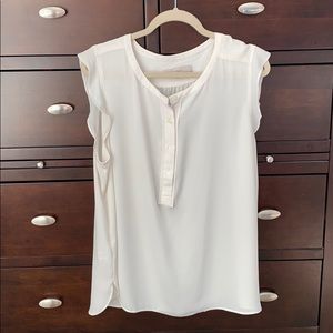 Off white shell with ruffle sleeve and buttons